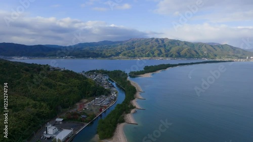 Aerial view of Amanohashidate and mountains with distant rainbow on Sea of Japan coast