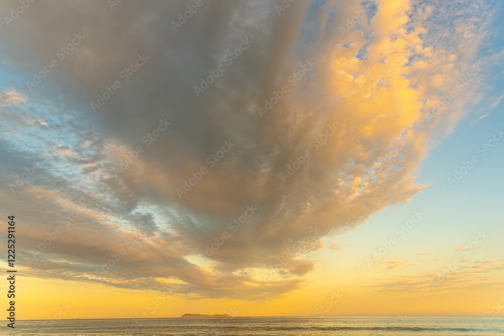 Obraz premium Rain clouds in the late afternoon at Gamboa Beach, Santa Catarina, Brazil.