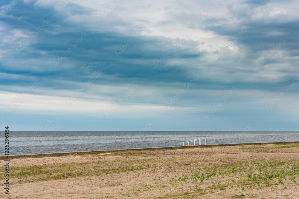 Storm clouds over an abandoned sea beach Storm clouds over an abandoned sea beach