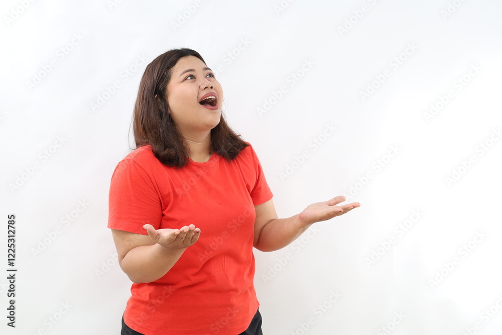 Portrait of surprised smiling pretty Asian woman looking upward and presenting with open palms gesture in isolated studio white background Portrait of surprised smiling pretty Asian woman looking upward and presenting with open palms gesture in isolated studio white background