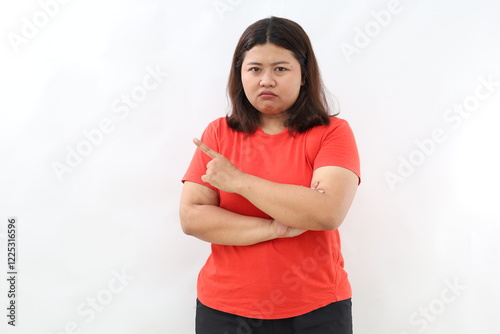 Moody upset whining woman unhappy pointing right, sulking look miserable and distressed, express regret and disappointment, complain bad fortune, stand white background displeased photo