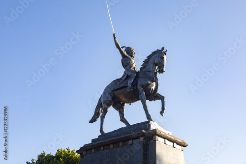 Statue of Chhatrapati Shivaji Maharaj on horseback riding a horse with raised sword Pratapgad, Maharashtra, India photo