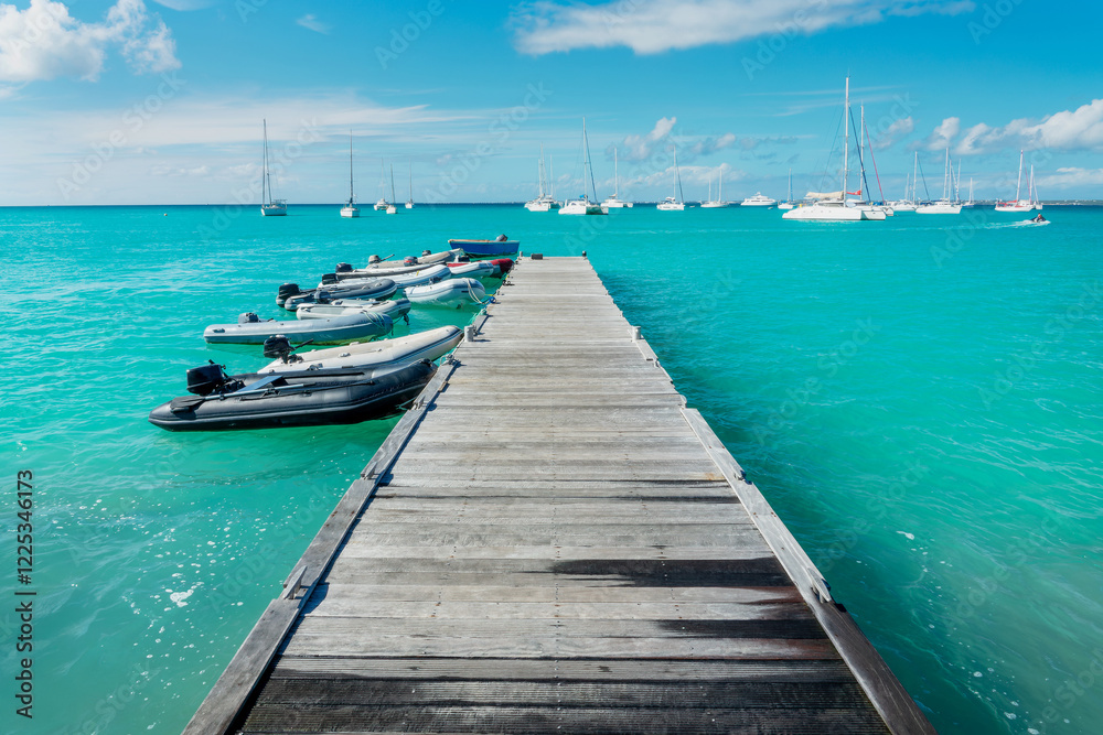 Old wooden pier on the beach of Grand Case, on the French side of the Caribbean island of Saint Martin (Sint Maarten), West Indies Old wooden pier on the beach of Grand Case, on the French side of the Caribbean island of Saint Martin (Sint Maarten), West Indies
