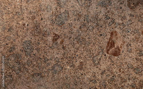 Natural stone texture with rough background in brown and ochre colors photo