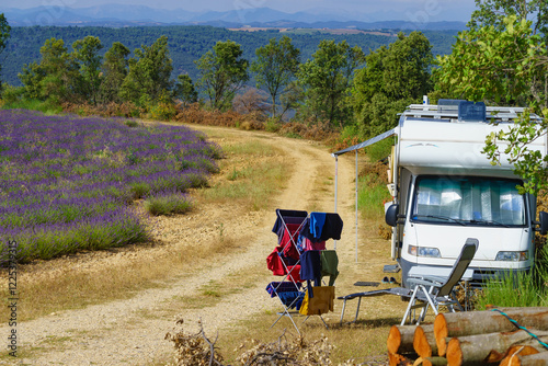 Clothes hanging to dry outdoors by camping car. Caravan vacation in France photo