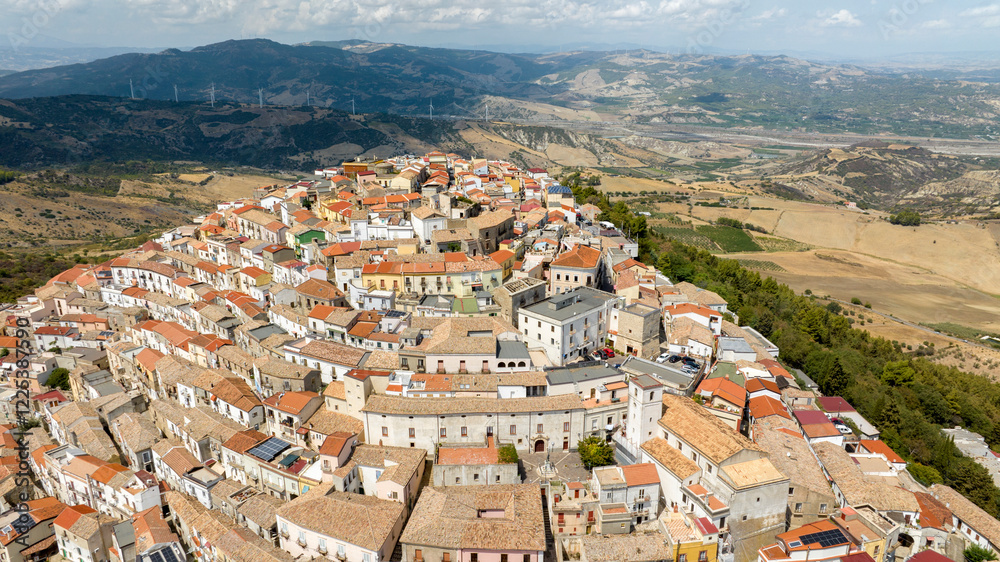 Fototapeta premium Aerial view of the town of Rotondella located on a hill in Basilicata, Italy. 