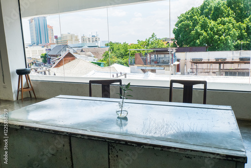 Photography Empty Table and chair in Korean restaurant or minimal cafe style with view of city in seoul korea,cafe japan or korea concept