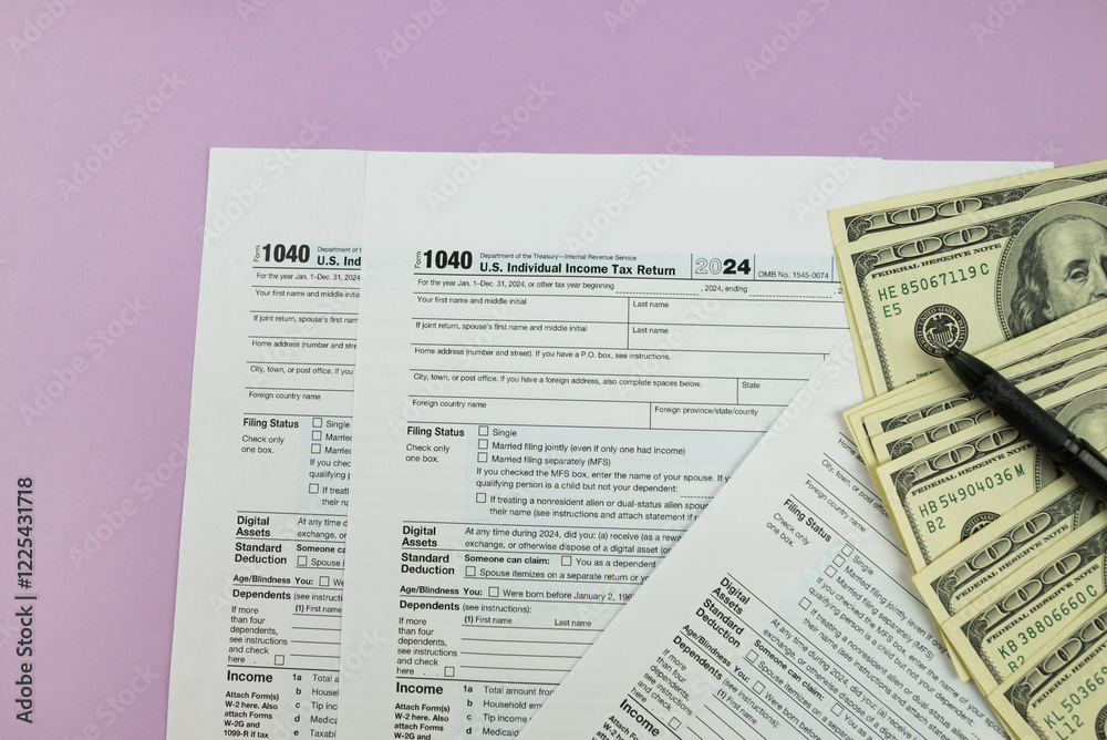 Naklejka premium 1040 tax form 2024 . Tax return forms 1040 with office supplies and dollar bills. Time to pay taxes.