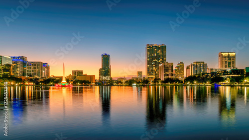 Orlando city skyline at sunset. Panoramic view of Orlando in Lake Eola Park, Florida, USA	