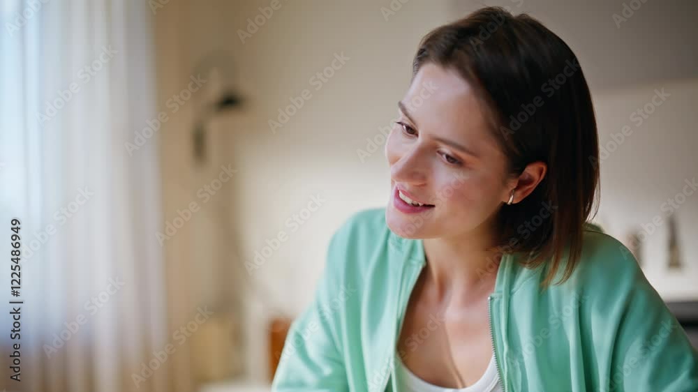 Girl tutor talking online conference sitting apartment living room closeup. Girl tutor talking online conference sitting apartment living room closeup.