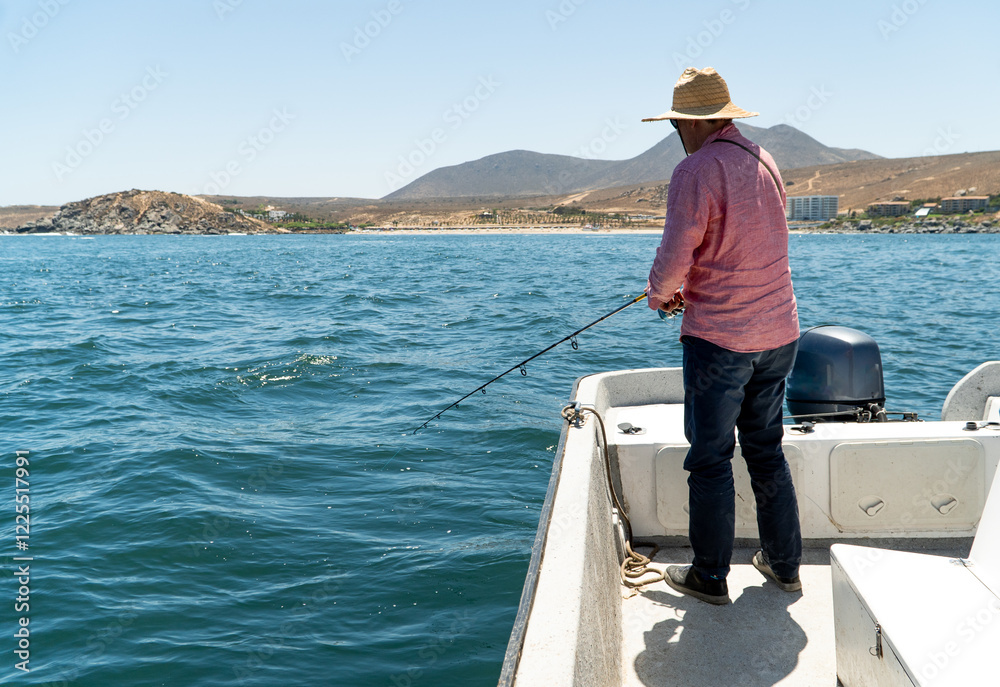 Man Fishing from a Boat on the Sea