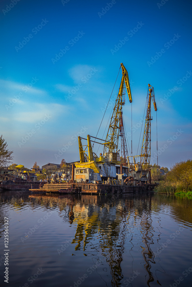 cargo cranes at the port on the Pregolya river in Konigsberg cargo cranes at the port on the Pregolya river in Konigsberg