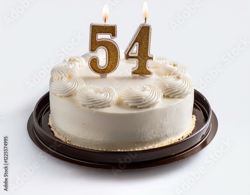 Decorated white cake for birthday or anniversary party, candle number 54, white background photo