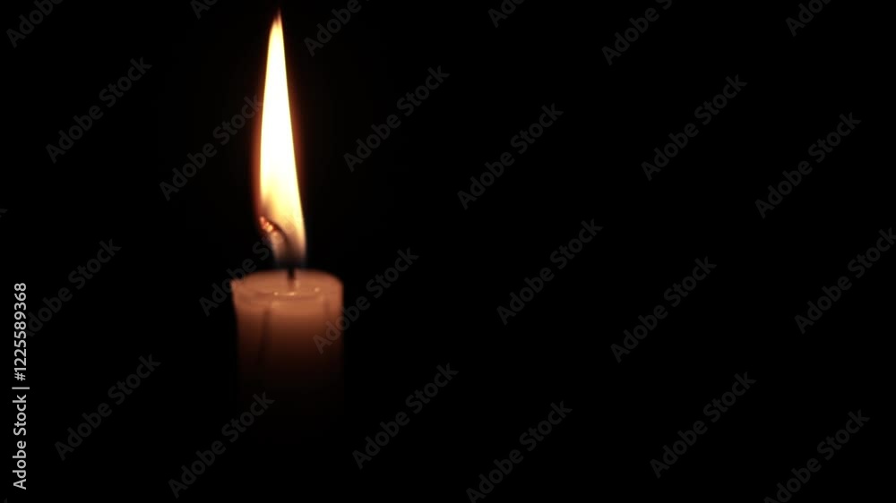 Lone Candle Flame Illuminating the Darkness Lone Candle Flame Illuminating the Darkness