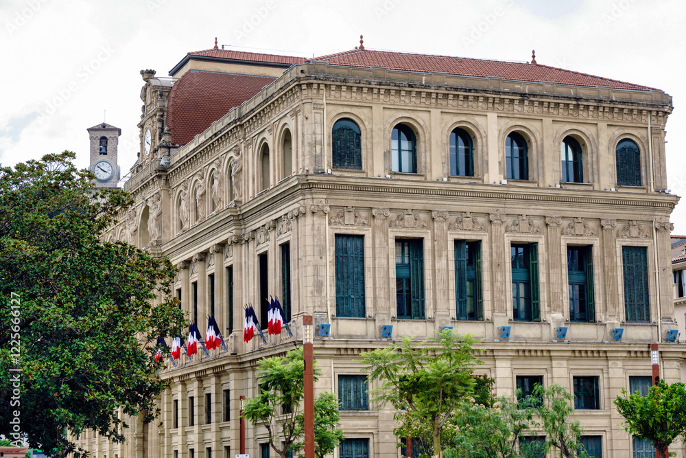 City town hall municipality buildings and castle tower with clock in Cannes, France