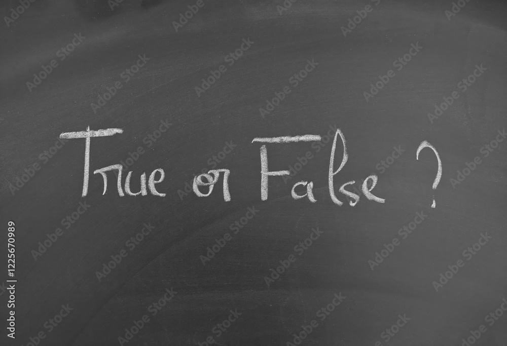 Fototapeta premium True or False written with chalk on a dark blackboard for learning or evaluation
