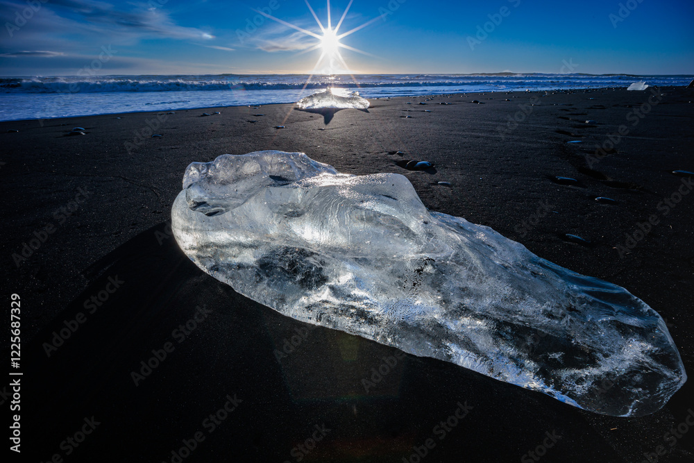 Loose segments of glacier washed out of Jokulsarlon glacial lake onto Diamond Beach on Iceland