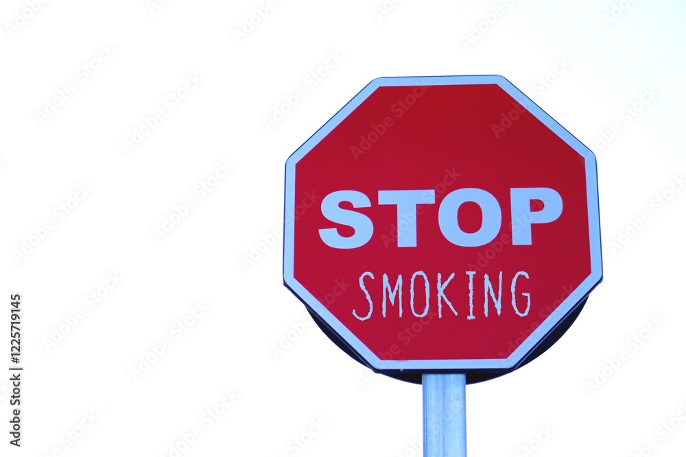 Stop smoking. public health problem. letters written on a highway stop sign. Stop smoking. public health problem. letters written on a highway stop sign.