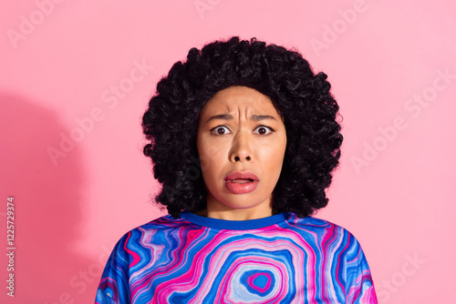 Photo of impressed terrified woman wear trendy print clothes isolated on pink color background photo