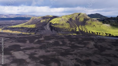 Aerial view of majestic volcanic mountains and expansive landscapes at sunset, Kirkjubaejarklaustur, Iceland. photo