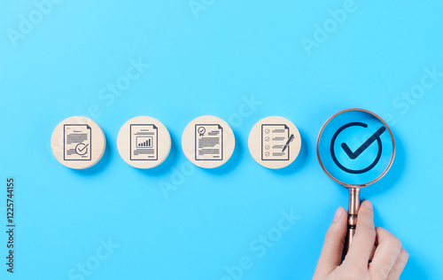 Quality control and certification assurance concept. A magnifying glass highlighting a checkmark certification and quality assurance icons, standard compliance, approval, and business quality control.