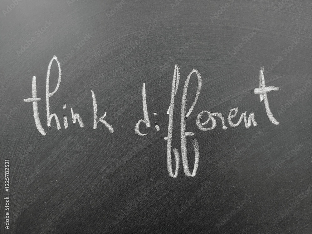 Fototapeta premium Think differently to inspire creativity and innovation, showcased by handwritten text on a chalkboard.