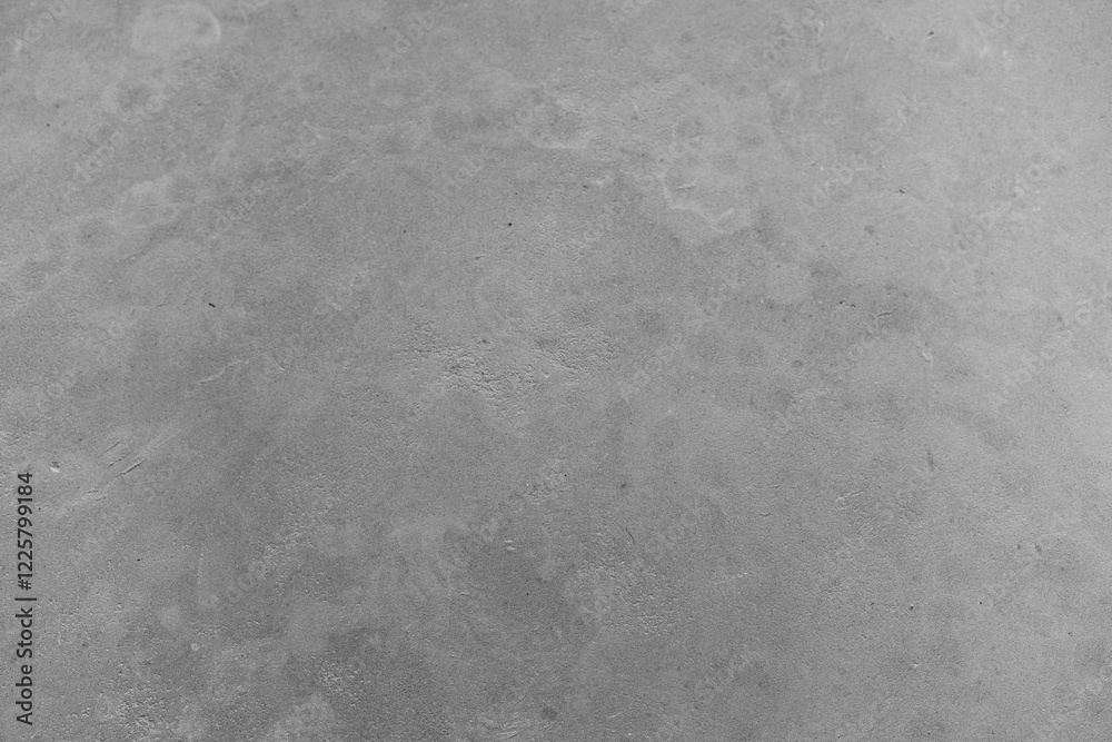 Naklejka premium Textured grey concrete surface offers a minimalist aesthetic