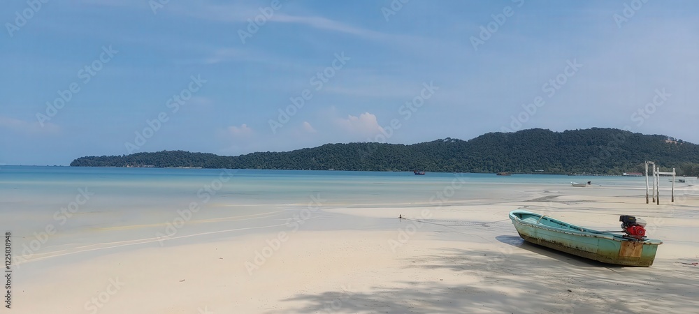 Turquoise waters meet the sandy beach where colorful boats rest under a clear blue sky Turquoise waters meet the sandy beach where colorful boats rest under a clear blue sky