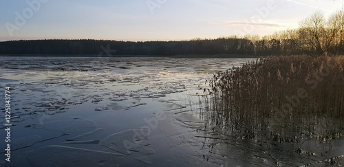 Winter wilight over a frozen lake