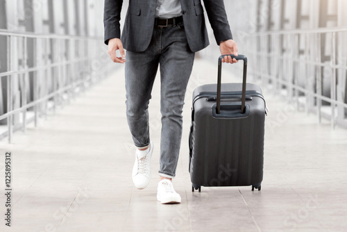 Travelling During Pandemic Concept. Arab Businessman In Protective Mask Walking With Suitcase At Airport Terminal, Middle Eastern Man Going To Departure Gate, Ready For Business Trip, Copy Space