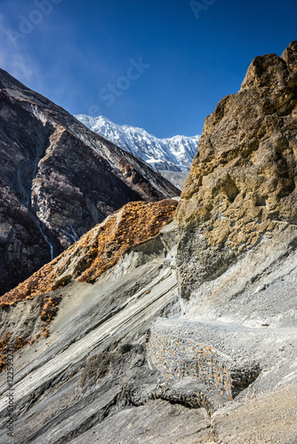 Trekking route to Tilicho base camp in a landslide area. Sunny autumn day in Himalaya mountains, Nepal. photo