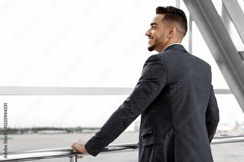 Rear View Of Young Arab Businessman Standing Near Window In Airport Terminal, Successful Millennial Middle Eastern Entrepreneur Waiting For Departure In Lounge Zone, Looking At Plane, Copy Space Rear View Of Young Arab Businessman Standing Near Window In Airport Terminal, Successful Millennial Middle Eastern Entrepreneur Waiting For Departure In Lounge Zone, Looking At Plane, Copy Space