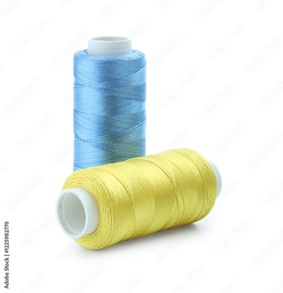 Spools of bright sewing threads isolated on white Spools of bright sewing threads isolated on white