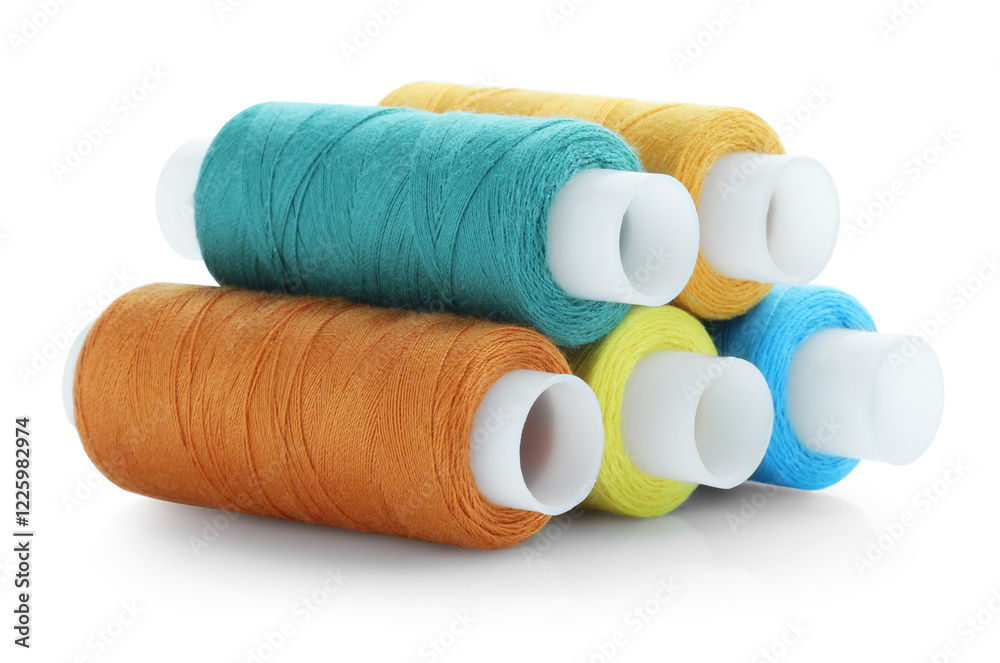 Spools of bright sewing threads isolated on white Spools of bright sewing threads isolated on white