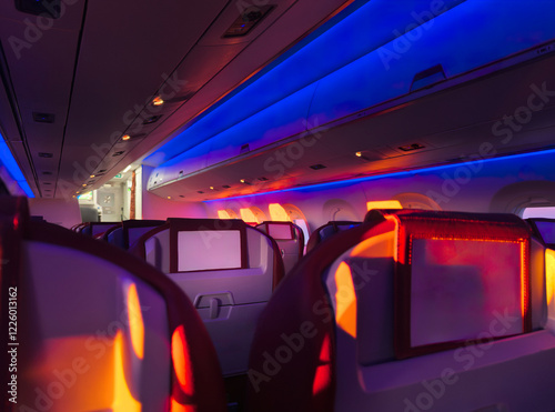 Mood lighting inside an airplane cabin during night flight photo