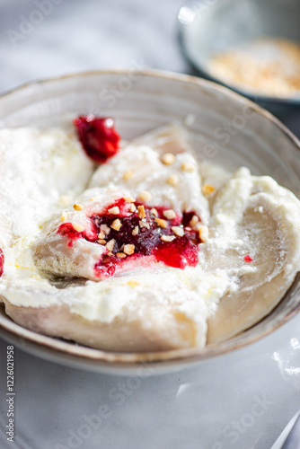 Traditional Ukrainian Varenyky with Cherry and Sour Cream Delight photo