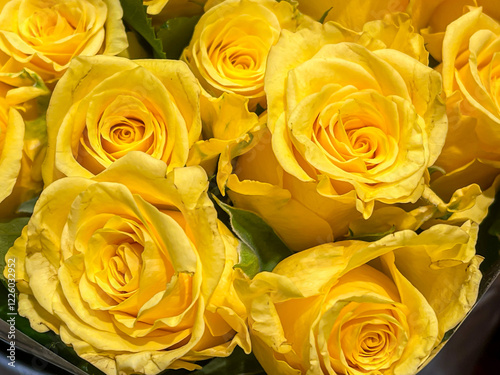 bright yellow spring roses bouquet arrangement, sales display. top down, full frame