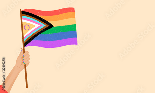 Hand holding inclusive pride flag symbolizing diversity photo