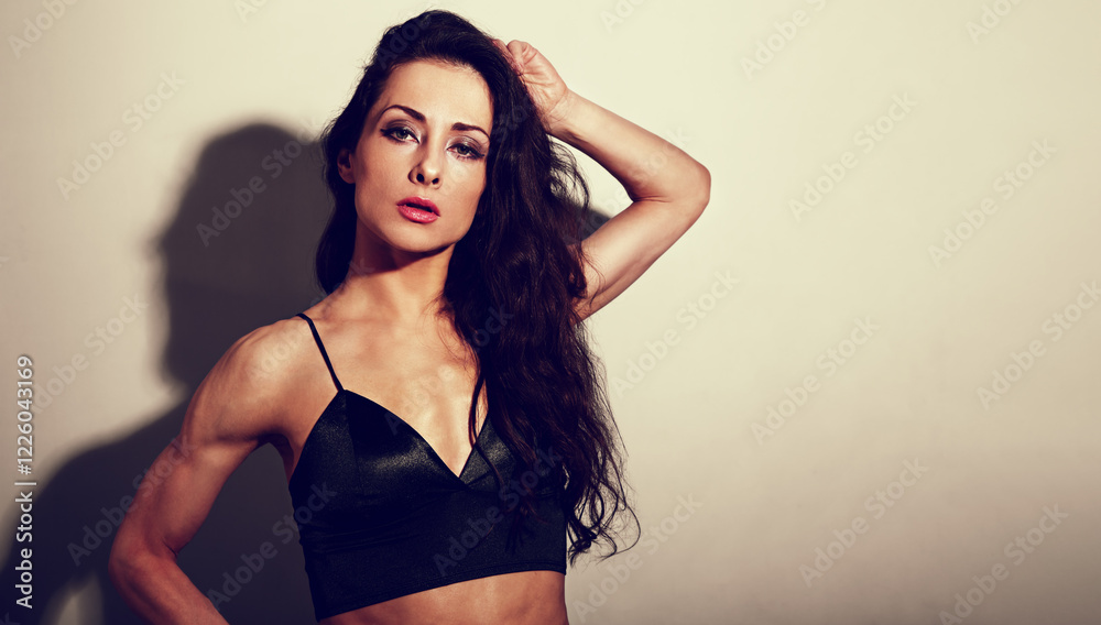 custom made wallpaper toronto digitalSexy bright makeup and red lipstick elegant woman in party black top posing in studio hard spot light and shadow, low key with empty space. Closeup toned