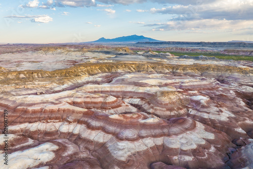 Aerial view of stratified bentonite hills under vast skies in Utah, USA