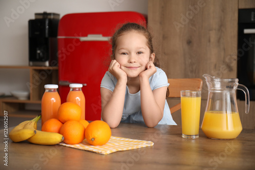 Little girl with glass of f...