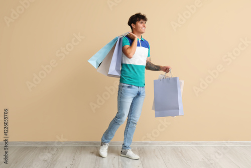 Young man with shopping bag...