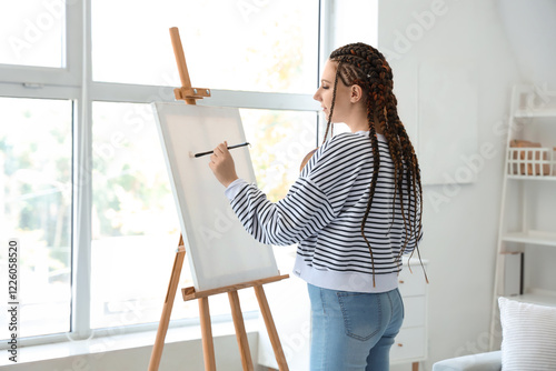 Young woman with dreadlocks...