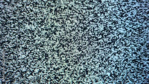 Close-up view of static noise on an old television screen.