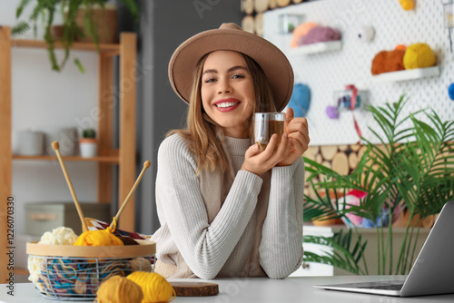 Young woman with cup of tea...
