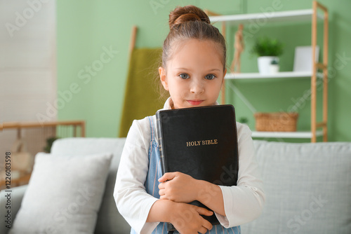 Cute little girl with Bible...