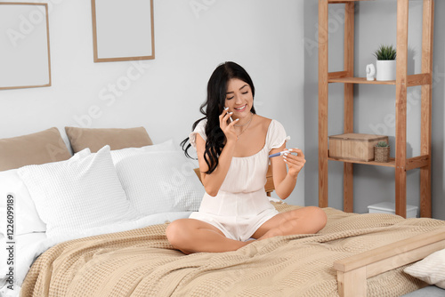 Happy young woman with preg...