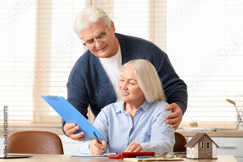 Senior man with his wife ca...