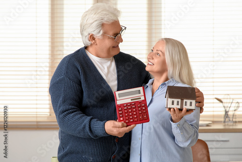 Senior couple with calculat...