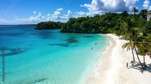 Tropical beach with turquoise waters  white sand  and palm trees swaying in the breeze